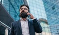 Busy bearded man speaking on phone Royalty Free Stock Photo