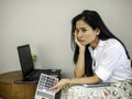 Beautiful asian business woman in coffee shop seriously looking to outside, introspective thinking about problem in work Royalty Free Stock Photo