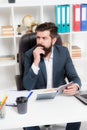 Busy boss in office. Check if i have time today. Man bearded hipster boss sit in leather armchair office interior. Boss