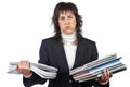 Busy business woman carrying stacked files Royalty Free Stock Photo