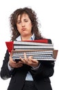 Busy business woman carrying stacked files Royalty Free Stock Photo