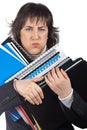 Busy business woman carrying stacked files Royalty Free Stock Photo