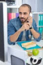 busy businessman eating lunch at office desk Royalty Free Stock Photo