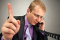 Busy businessman talking by phone Royalty Free Stock Photo