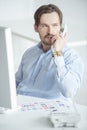 Busy businessman talking phone at his desk Royalty Free Stock Photo