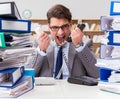 Busy businessman under stress due to excessive work Royalty Free Stock Photo