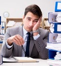 Busy businessman under stress due to excessive work Royalty Free Stock Photo