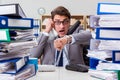 The busy businessman under stress due to excessive work Royalty Free Stock Photo