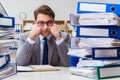 The busy businessman under stress due to excessive work Royalty Free Stock Photo