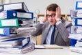 The busy businessman under stress due to excessive work Royalty Free Stock Photo