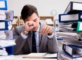 Busy businessman under stress due to excessive work Royalty Free Stock Photo