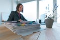 Busy businesswoman doing paperwork in office