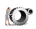 Busy businesswoman pushing cogwheel