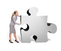 Busy businesswoman pushing puzzle piece Royalty Free Stock Photo