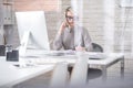 Busy Businesswoman Speaking by Phone Royalty Free Stock Photo