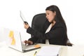 Busy businesswoman suffering stress working at office computer desk worried desperate