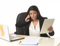 Busy businesswoman suffering stress working at office computer desk worried desperate Royalty Free Stock Photo