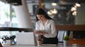 Businesswoman working with laptop computer and searching information on digital tablet. Royalty Free Stock Photo