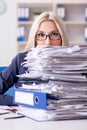 The busy businesswoman working in office at desk Royalty Free Stock Photo