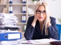 Busy businesswoman working in office at desk Royalty Free Stock Photo