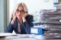 The busy businesswoman working in office at desk