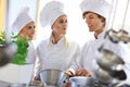 Busy chefs at work in the restaurant kitchen Royalty Free Stock Photo