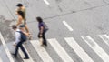 Busy city blur people move to pedestrian crosswalk on busine