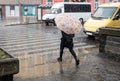 Busy city people on zebra crossing in motion blur. Winter snowy day, dangerous situation