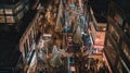 A busy city street at night with christmas lights. Generative AI image.