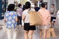 Busy city street people with paper shopping bags. Royalty Free Stock Photo