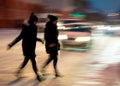 Busy city street people on zebra crossing at night Royalty Free Stock Photo