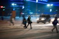 Busy city street people on zebra crossing at night Royalty Free Stock Photo