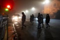 Busy city street people on zebra crossing at night. Dangerous situation Royalty Free Stock Photo