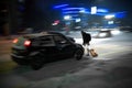 Busy city street people on zebra crossing at night. Dangerous situation Royalty Free Stock Photo