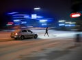 Busy city street people on zebra crossing at night in winter Royalty Free Stock Photo