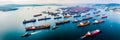 busy coastal harbor from above, with ships docked, cargo being loaded, and the comings and goings of maritime activity