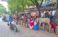 Busy colorful street road people restaurants buildings stores Agra India