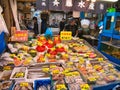 A busy, colourful fish market stall selling fresh fish, seafood and crab products in Tokyo, Japan Royalty Free Stock Photo