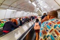 Busy commuters on elevators of an underground station in London, UK Royalty Free Stock Photo