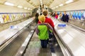 Busy commuters on elevators of an underground station in London, UK Royalty Free Stock Photo