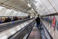 Busy commuters on elevators of an underground station in London, UK Royalty Free Stock Photo