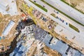 Busy construction site. crane, construction materials and machinery. aerial drone photo