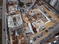 Busy Construction Site and Construction Equipment Aerial Photo at sunset