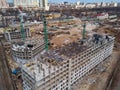 Busy Construction Site and Construction Equipment Aerial Photo at sunset