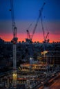 Busy construction site with multiple towering skyscrapers in the foreground Royalty Free Stock Photo