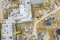 Busy construction site, shot from above. yellow cranes near building under construction Royalty Free Stock Photo
