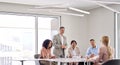 Busy diverse executive team working communicating at office meeting. Copy space Royalty Free Stock Photo