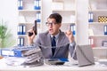 The busy employee chained to his office desk Royalty Free Stock Photo