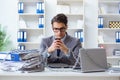 The busy employee chained to his office desk Royalty Free Stock Photo