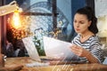 Busy employee looking at the documents while working at home